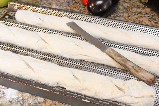 Place the dough into the 3 barrel pan and cut diagonal slices along with top with a serrated knife.